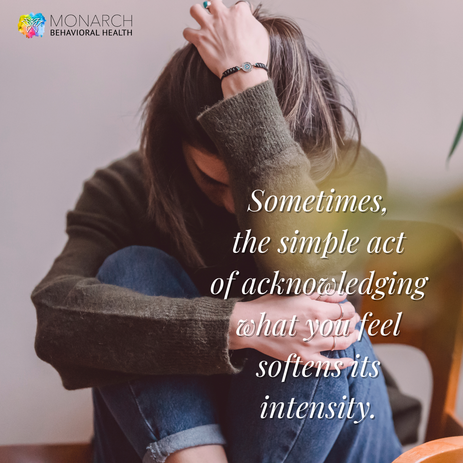Person sitting with head down and arms wrapped around knees, reflecting emotional overwhelm, with text about acknowledging feelings as a way to calm anxiety fast.