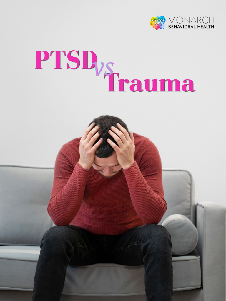 A man in a red sweater sits on a gray couch with his head in his hands, conveying emotional distress illustrating the difference between PTSD vs trauma in San Antonio, presented by Monarch Behavioral Health in San Antonio