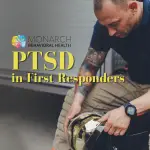 Firefighter kneeling with his helmet, illustrating PTSD in first responders and the toll of the job — Monarch Behavioral Health, San Antonio